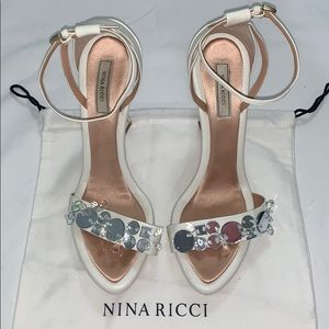 Nina Ricci white leather wedge.